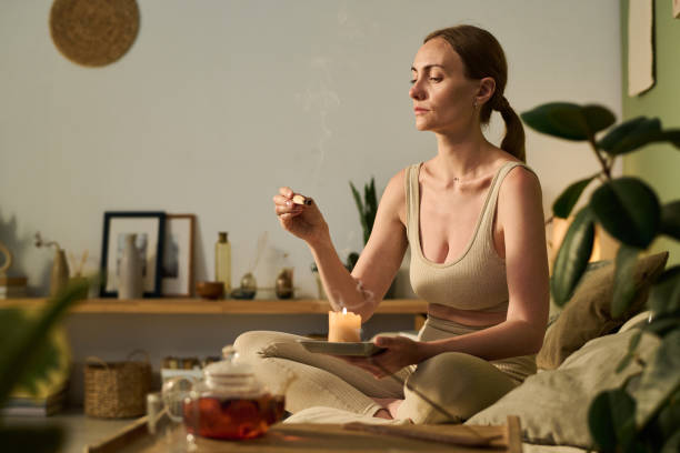 Woman with smoking sandalwood stick