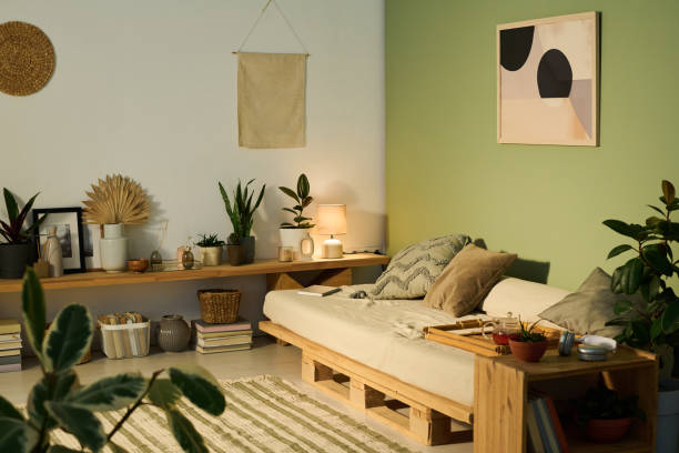 istock Comfortable couch with cushions and tray 2171707222