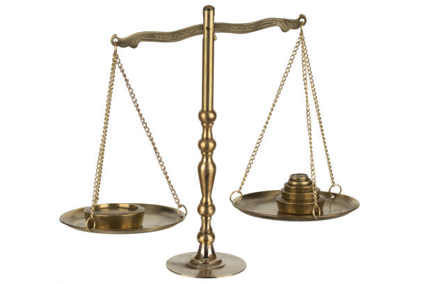 istock Bronze traditional balance scale with weights isolated on white 2171711000