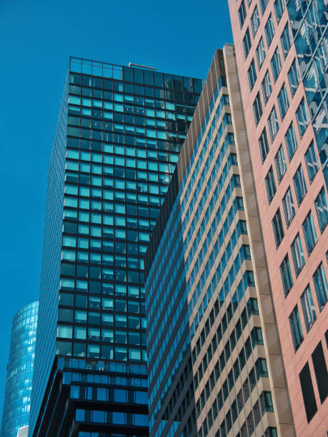istock skyscraper, Frankfurt am Main with a red facade and a glass front in a clear sky 2171713849
