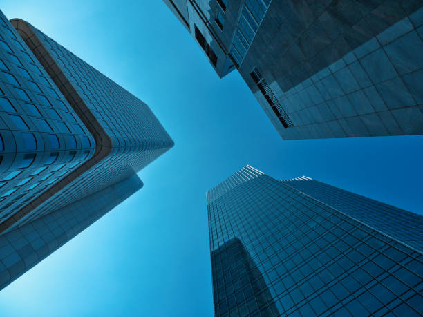 istock shot between the skyscraper towers racing through the sky with blue sky 2171713904