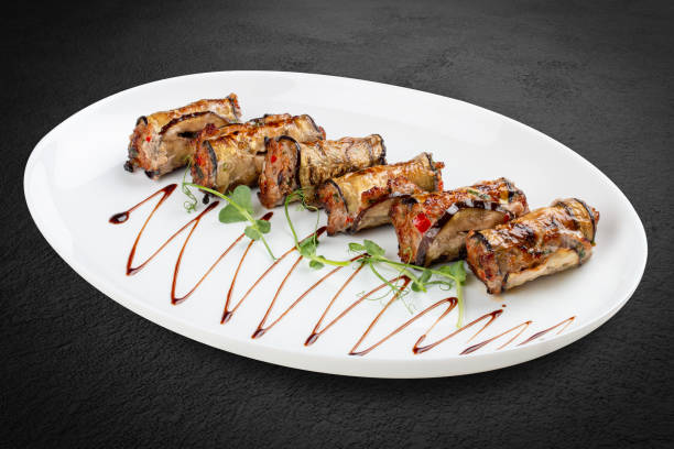 istock A savory meat roll stuffed with roasted eggplant, creating a flavorful blend of textures and tastes. 2171716028