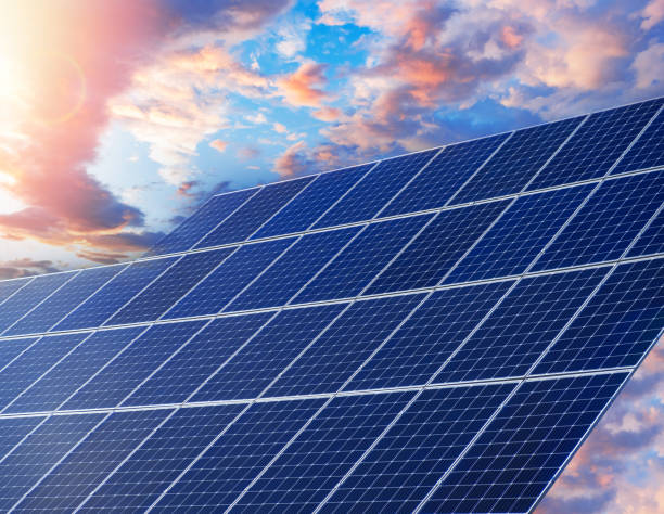 istock Solar energy panels against sky with clouds 2171717436