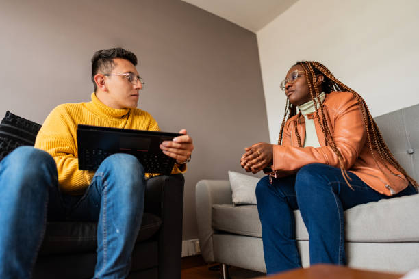 istock Young woman talking with psychologist during therapy session 2171720855