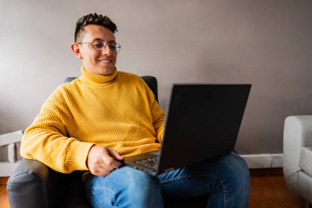 istock Young man talking on a video call using laptop at home 2171720890
