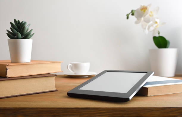 istock Ebook on table at home with coffee and decoration plants 2171721537