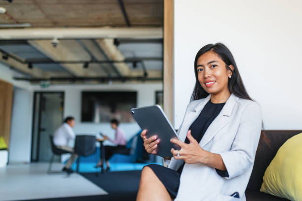 istock Asian Businesswoman Using Digital Tablet in Office 2171722142
