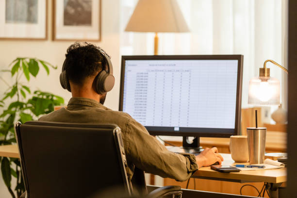 istock Unrecognizable young adult male student works on his computer 2171723057