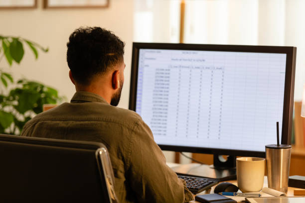 istock Unrecognizable young adult male works on his computer 2171723058