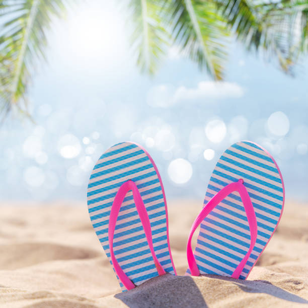 istock Flip flops on the sea beach 2171724633
