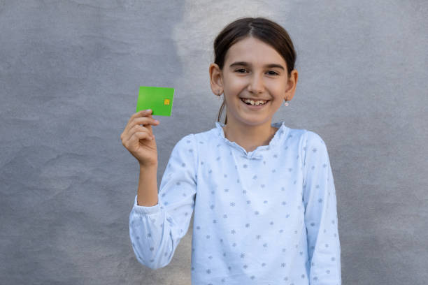 One little girl smiling after making her first purchase