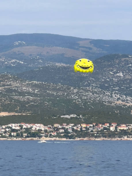 istock yellow parachute at the sea 2171724801
