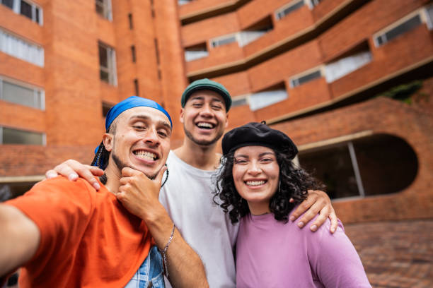 istock Friends taking a selfie embracing outdoors - camera point of view 2171726501