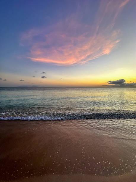 istock Calm beach at sunset with soft pastel skies 2171726639