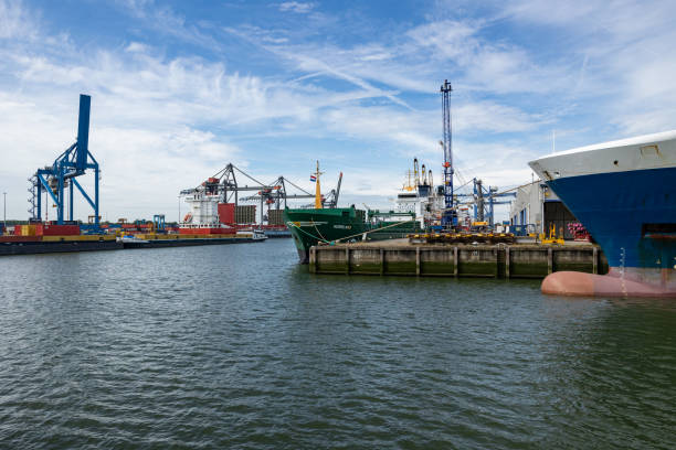 Rotterdam, Netherlands - July 9, 2004: Ships being loaded in the port of Rotterdam