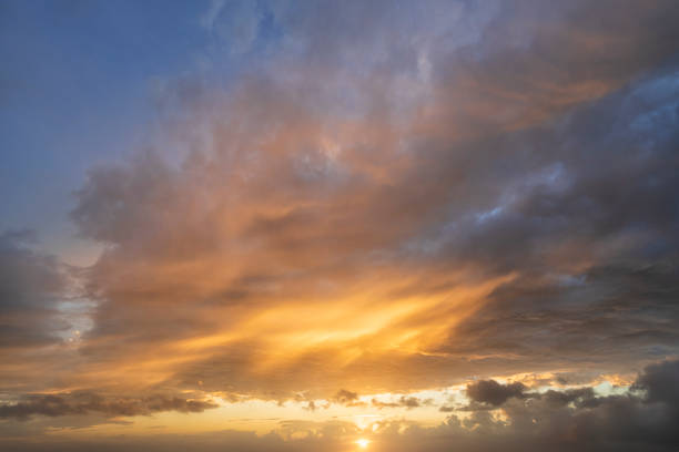 istock Glowing real sky at sunset texture background overlay. Dramatic red and orange clouds. 2171728028