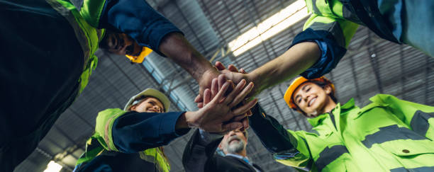 istock Group of successful Worker people showing unity with their hands together. Photo Foreman hands on top as symbol of Teamwork. Teamwork concept. 2171729213
