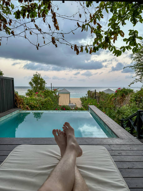 istock Relaxing by the pool with ocean view. 2171730650