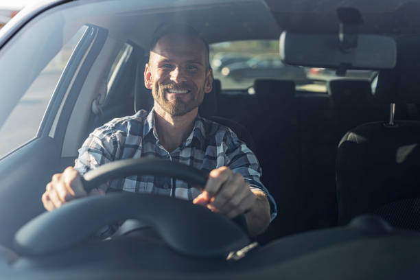 istock The driver is a young attractive man driving a car. 2171730889