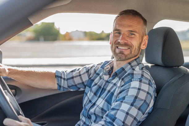 istock The driver is a young attractive man driving a car. 2171730902