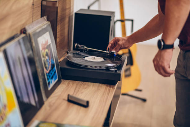 istock Man listening to music with retro turntable 2171735005
