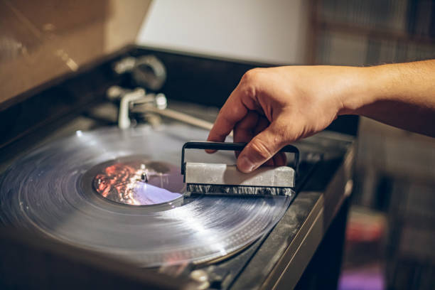 istock Man cleaning vinyl record 2171735179