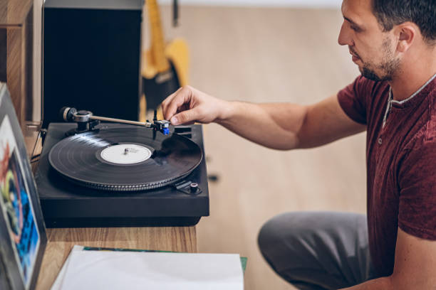 istock Man listening to music with retro turntable 2171735337