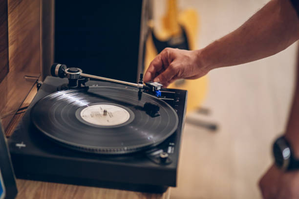 istock Man listening to music with retro turntable 2171735576