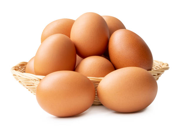 istock Group of fresh brown chicken eggs in stack in wicker basket isolated on white background with clipping path 2171738699