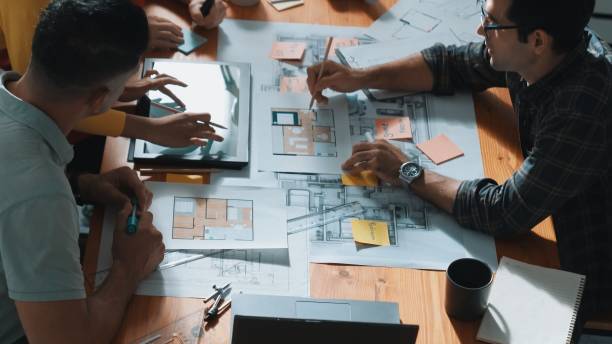 istock Top view of smart team working together to plan house construction. Symposium. 2171750000