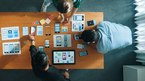 istock Top view of skilled Ui designer brainstorming about Ux Uo design. Convocation. 2171751934