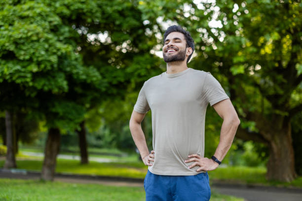 istock Joyful sportsman relaxing in park after invigorating workout outdoors on sunny day 2171765249