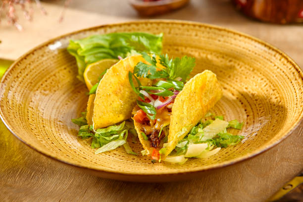 istock Delicious Beef and Vegetable Taco on Rustic Plate 2171767368