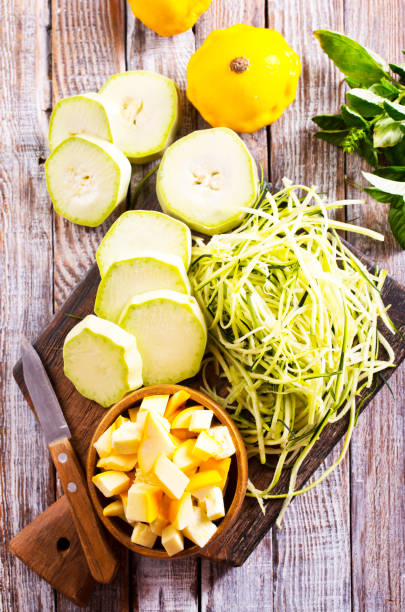 istock raw zucchini and patisons on board 2171767616