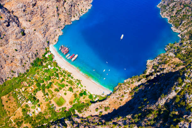 Butterfly Valley Beach or Kelebekler Vadisi aerial panoramic view. Butterfly Beach is a beautiful beach near Oludeniz town, district of Fethiye in Turkey.