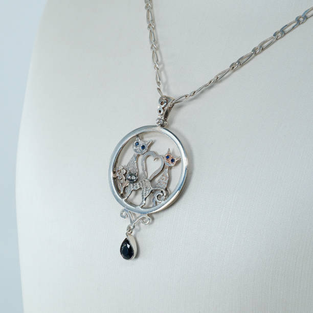 Silver necklace with funny cat symbols