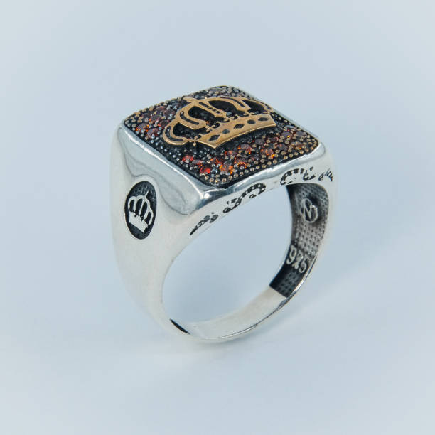 A handmade ring with a royal crown symbol on it