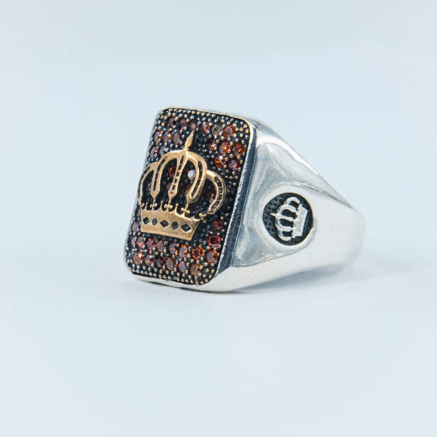 A handmade ring with a royal crown symbol on it