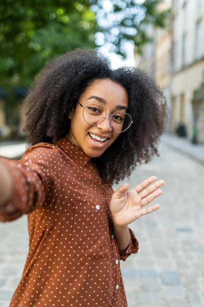 istock Smiling woman with glasses taking selfie outdoors on sunny day 2171775264