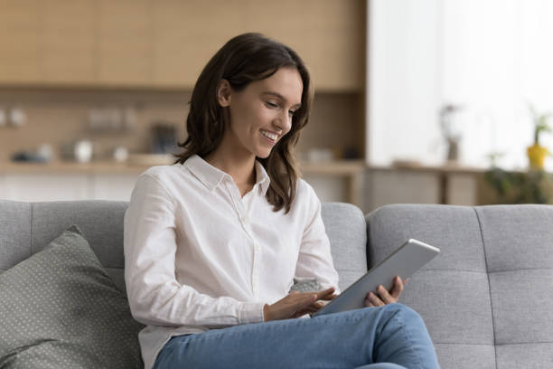 istock Woman spend leisure on internet using modern wireless digital tablet 2171775306
