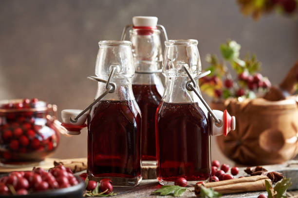 istock Three bottles of medicinal wine prepared from fresh hawthorn berries ans spices 2171783746