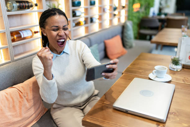 istock Woman using a phone in a cafe 2171788371