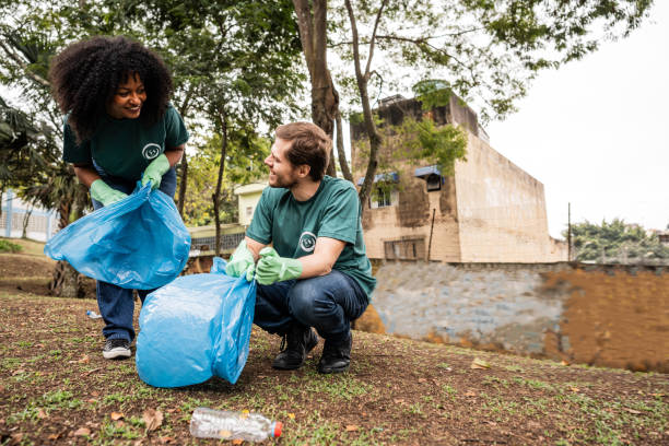 istock People picking up garbage to clean a public park 2171791288