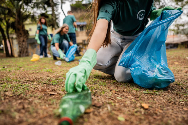 istock People picking up garbage to clean a public park 2171791304