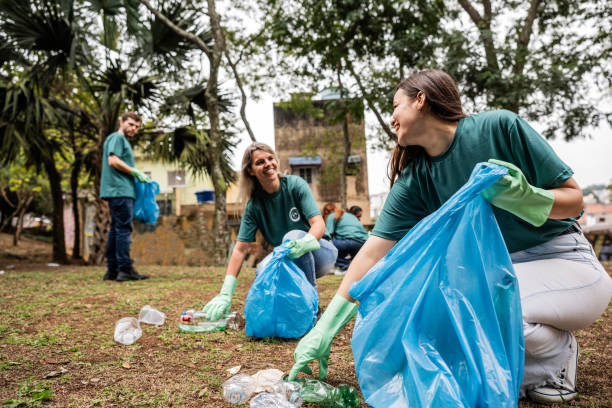 istock People picking up garbage to clean a public park 2171791309