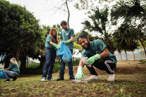 istock Young man picking up garbage to clean a public park 2171791485
