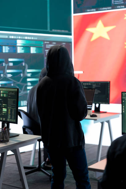 istock Terrorist person in a Chinese cyber security room hacking national systems 2171792820