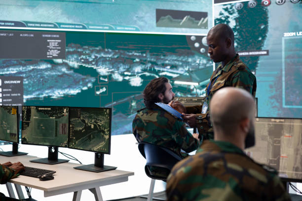 istock Commander and his squad operating satellite systems via CCTV and radar 2171797854