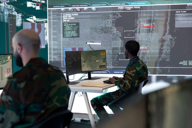 istock Team of national guard machinists operating on CCTV satellite system 2171798242