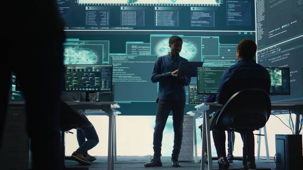 istock Group of governmental hackers analyzing digital threats on pc networks 2171802586